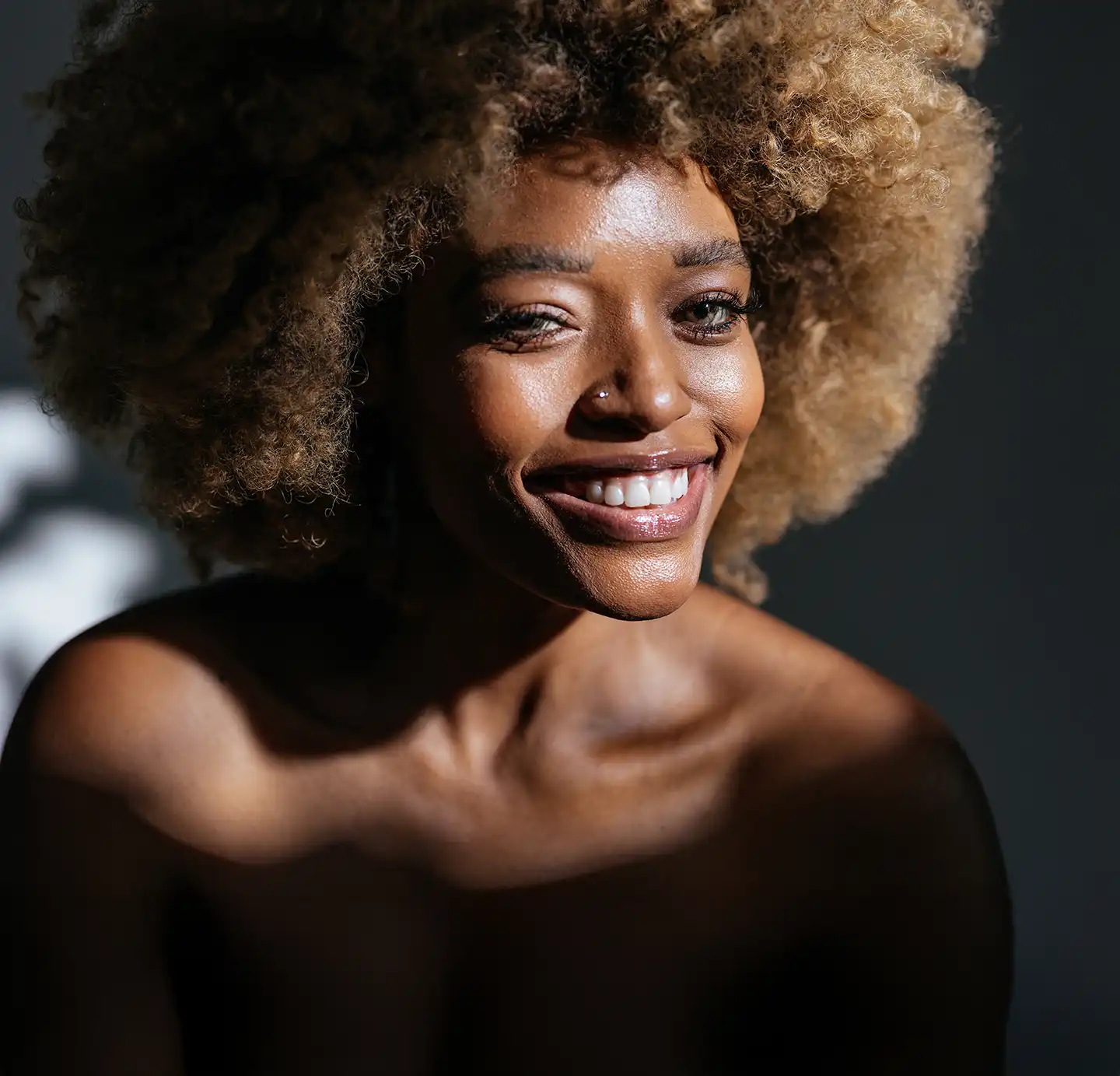 black beautiful woman, 
with afro hairstyle and curly hairs
